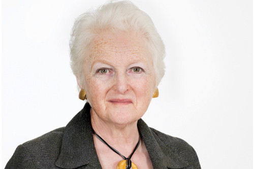 A headshot of Baroness Neuberger wearing a dark green jacker